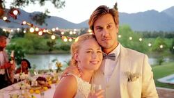 Bride and groom hugging at wedding reception Stock Footage