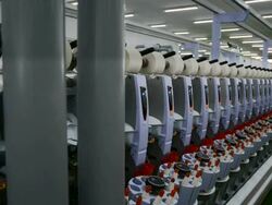 Row of Yarn Machines reeling in factory Stock Footage