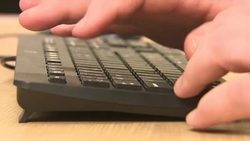 Male Caucasian Hands Typing on Keyboard News Clip