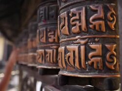 CU Spinning prayer wheels outside of temple / Kathmandu, Banke District, Nepal Stock Footage