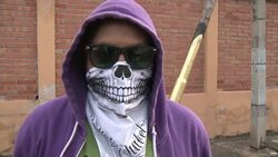 Masked artist protests violence in Honduras News Clip