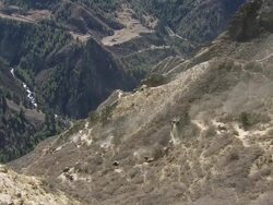 MS Nomadic woman and horse descending steep mountain trail / near Ringmo village, Himalayas, Upper Dolpo, Nepal   Stock Footage