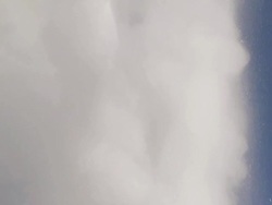 CU Water erupting from geyser against blue sky / Yellowstone National Park, Wyoming, United States  Stock Footage