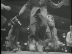 In 1941 musician Harry James plays trumpet and couples dance the jitterbug. News Clip
