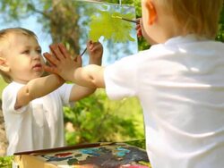 little boy drawing on nature Stock Footage
