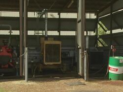 Three electrical generators in corrugated shed, Mungalalu Truscott Airbase, WA, Australia Stock Footage