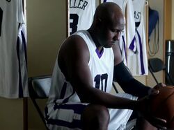 CU PAN professional basketball player in locker room holding basketball / Washington, USA Stock Footage