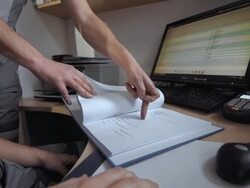 Mechanics Doing Paperwork Stock Footage