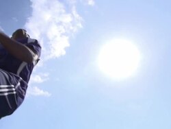 A man playing soccer on a grassy field. - Slow Motion - filmed at 240 fps Stock Footage