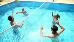 Friends playing volleyball in swimming pool. Stock Footage