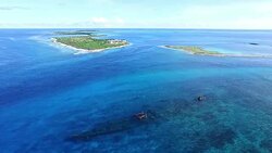Shipwreck SS President Taylor with Kanton Island behind Stock Footage