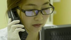 CLose up woman laboratory working on computer and telephone Stock Footage