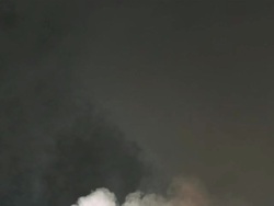 Smoke building up against black background Stock Footage