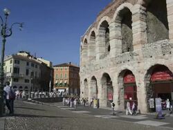 MS T/L Shot of Tourists roaming in front of Arena di Verona at Piazza Bra / Verona, Veneto, Italy Stock Footage