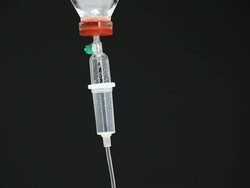 CU TILT DOWN Intravenous drip in sick room Stock Footage