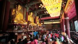 Worshippers inside Jogyesa Temple, Jongno-gu district, Seoul, South Korea, Asia Stock Footage