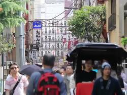 MS Signs and pedestrian / Asakusa, Tokyo, Japan Stock Footage