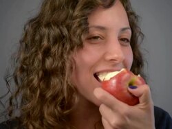 Young woman eat red apple. Stock Footage