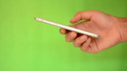 Smartphone touchscreen on green screen Stock Footage