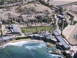 Aerial the ruins, including hippodrome aka Circus, of ancient Caesarea, Israel Stock Footage