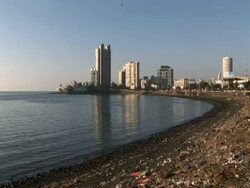 Tilt down skyline to rubbish, Mumbai, India Stock Footage