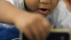 The boy listening music Stock Footage