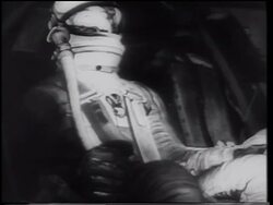 B/W 1961 Alan Shepard in spacesuit sitting in Mercury 3 space capsule / first American in space Stock Footage