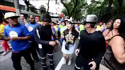 CLEAN : Two Sao Paulo revellers dress as mosquitoes for street carnival News Clip