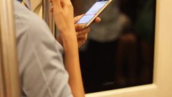Crowded people in the mass public transportation using their phone Stock Footage