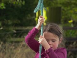 Young Girl Enjoying A Rope Swing Stock Footage