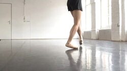 Female ballet dancer dancing on tiptoes in rehearsal room Stock Footage