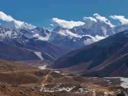 Panning shot of Time-lapse of clouds passing over a Himalayan valley. Stock Footage