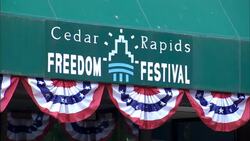 A mannequin with a flotation jacket is positioned near a valve which pumps flood water beneath a Cedar Rapids Freedom Festival awning. Stock Footage