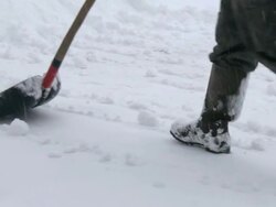 HD SLOW-MOTION: Snow shoveling Stock Footage