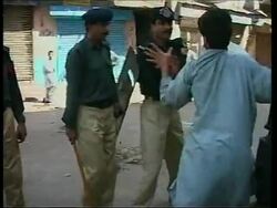 Clashes between police and demonstrators in Karachi. News Clip