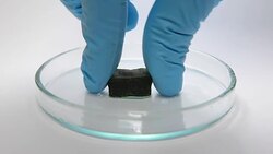 weight bearing experiment of green gel with human hand Stock Footage