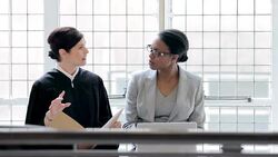 Judge and lawyer talking at desk Stock Footage