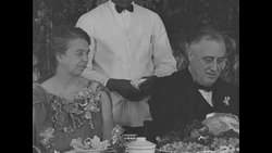 Franklin and Eleanor Roosevelt at Thanksgiving dinner at the Georgia Warm Springs Foundation News Clip