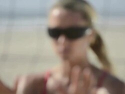 ECU CU R/F portrait of a female beach volleyball getting ready to block at the net. Stock Footage