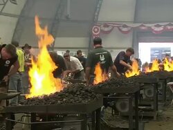 MS Shot of participators playing in blacksmith competition at Calgary Stampede / Calgary, Alberta, Canada Stock Footage