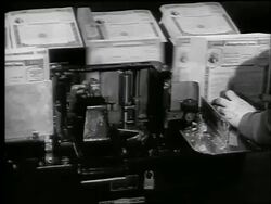 B/W 1944 close up woman's hands next to machine sorting Army War Bonds / World War II / newsreel Stock Footage