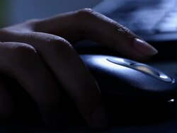 Woman using a computer mouse  Stock Footage