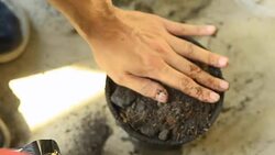 top view: use trowel to put soil in a plastic pot Stock Footage