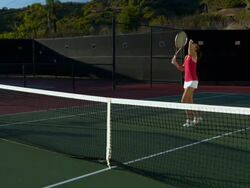 WS, PAN, Two young women shaking hands above tennis net, Santa Barbara, California, USA Stock Footage