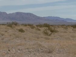 Male running through desert Stock Footage