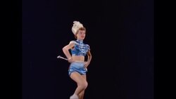 MS Female drum major twirling baton and marching in place / United States Stock Footage