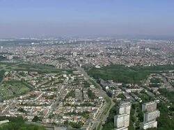WS AERIAL PAN TS View of city and Jeff Koons sculptures Butt plug santa / Flemish Region, Belgium Stock Footage