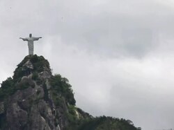 WS Corcovado statue heat coming up Para gliders flying / Rio de Janeiro, Brazil Stock Footage