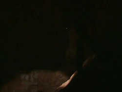 MS Explorer exploring in cave with torchlight / Mutawintji National Park, New South Wales, Australia Stock Footage