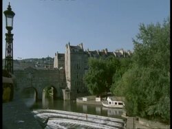 Pulteney Bridge & Weir, Bath, Avon - old stone bridge over river Avon Stock Footage